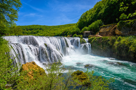 Amazing Strbacki buk waterfalls on river Una in Bosnia and Herzegovina. Beautiful nature in Una national park with crystal clear water and amazing cascade waterfalls.の写真素材