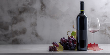 A bottle of wine and a glass with a bunch of grapes on a marble table top. Generative AIの素材