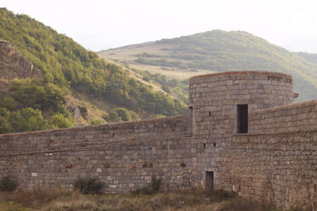 insiide of shielding wall of Tatev monastery (IX century, Armenia), mountains and forests in...