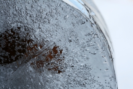 Many air bubbles trapped in the iceの写真素材