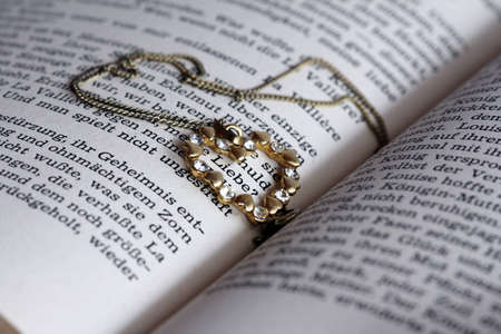 Love, romance, jewelry and a bookの写真素材