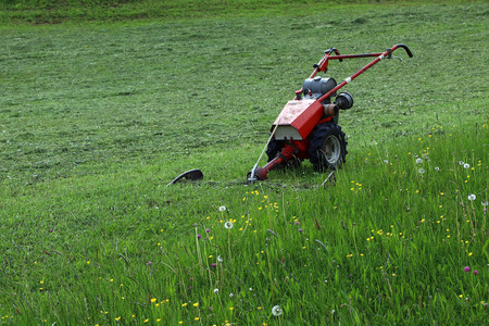 Agricultural machine - A motor mower in the fieldの写真素材
