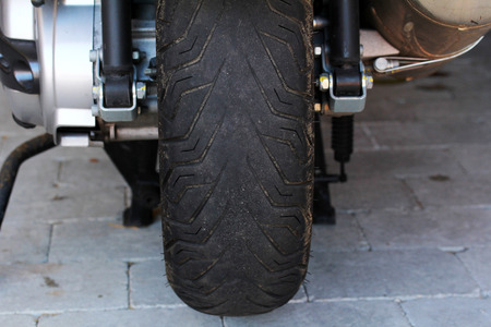 A worn tire on a motorcycle is dangerous