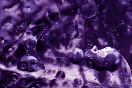 Close-up of a piece of water on ice in ultraviolet. Abstract Art of Natureの写真素材