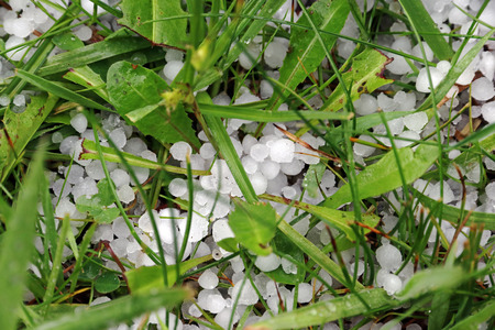 Thunderstorm with heavy hail and sleet showers. Hailstones on the groundの写真素材