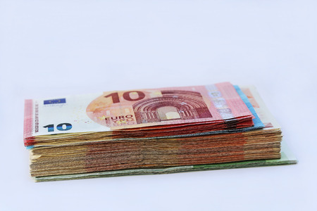 A large pile of euro notes. Lots of money in one pile