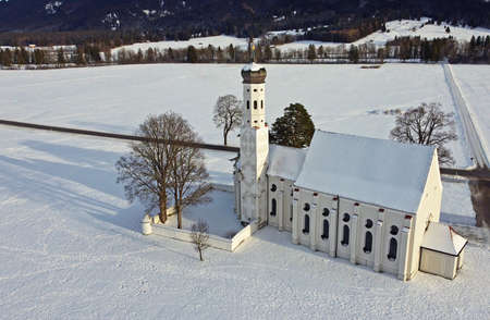 Drone shot of the famous baroque Colomanskirche near Schwangau in Bavaria in winter