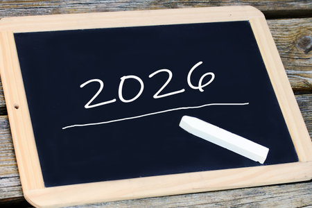 A blackboard and chalk with the year 2026 written on it