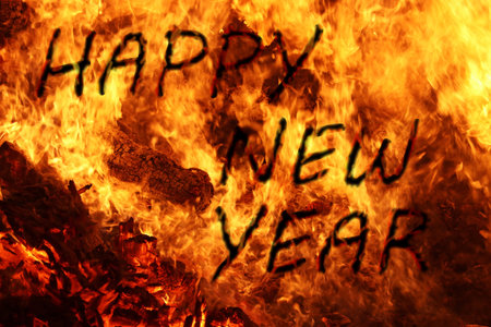 Happy New Year as a font made of fire and a background of flamesの写真素材