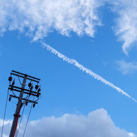 electricity post with skyの写真素材