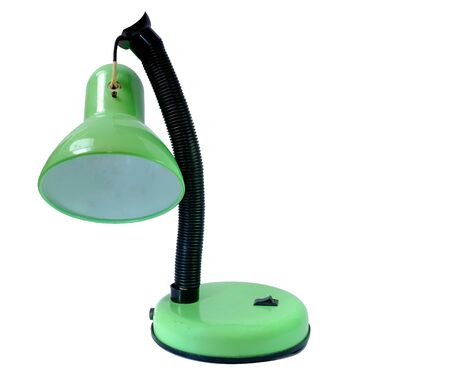 old broken green table lamp nand on bulk in isolatedの写真素材