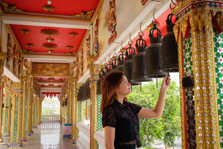 one thai young girl in black praying in templeの写真素材