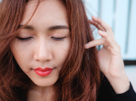 close up on eyes and face asian beauty hair,Portrait of tender natural beautiful redhead young adult woman looking camera at homeの写真素材