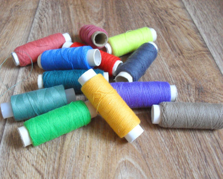 reads of different bright rainbow colors on wood background