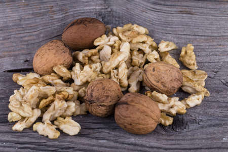 Walnuts on a wooden background