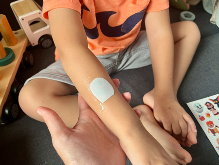 The kid makes himself transferable tattoos. Cute Halloween temporary tattoo.の写真素材