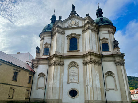 Cistercian state monastery Osek, Ossegg front church, Czech Republic. A rose hip bushの写真素材