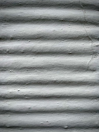 Gray ribbed concrete wall texture industrial background. Vertical