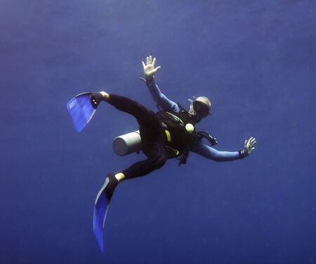 diver  against blue sea background underwaterの写真素材