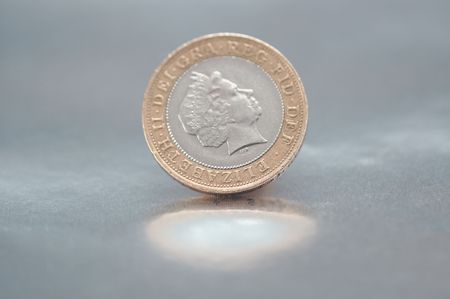 Two pounds coin on silver plateの写真素材