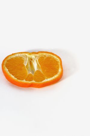 Mandarin (Citrus reticulata) slice against white backgroundの写真素材