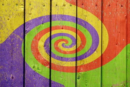 A colorful swirl pattern painted on 2X4 boards.の写真素材