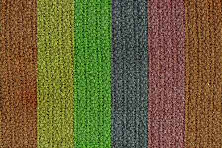 A texture background of a woven wool texture with vertical colored strips.の写真素材