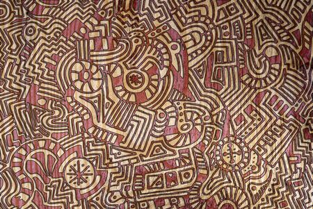 An intricate, unique, abstract, hand drawn background of a modern-art style design on a wood textured surface.の写真素材