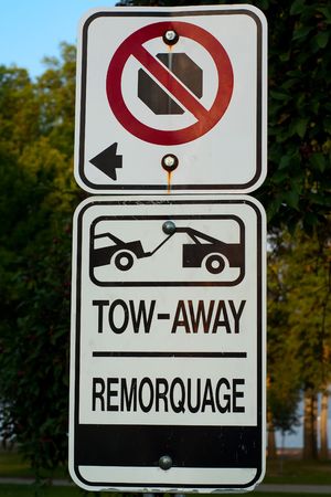 No stopping - no parking - tow-away zone street sign.