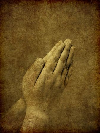 A set of praying hands - image has been textured and distressed to simulate an old and aged ambrotype photo from the Victorian era.の写真素材