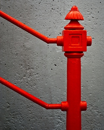 Abstract composition of the close detail of an antique, wrought iron railing post.の写真素材