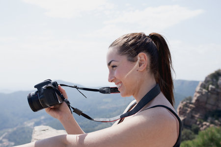 girl with camera on the mountain