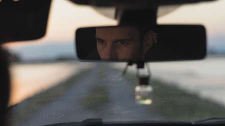 Car with a sunset in the backgroundの写真素材