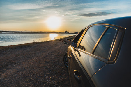 Car with a sunset in the backgroundの写真素材