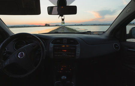 Car with a sunset in the backgroundの写真素材