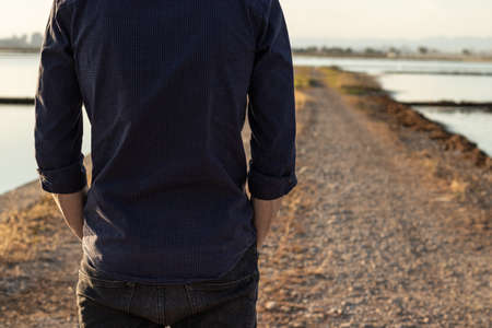 detail shot of a hand in the back pocket of a cowboyの写真素材
