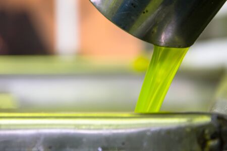Fresh virgin olive oil production at a cold-press factory after the olive harvesting, Crete, Greece.の写真素材