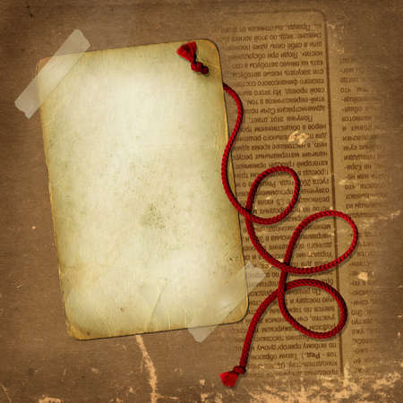 Old paper with red rope for designの写真素材