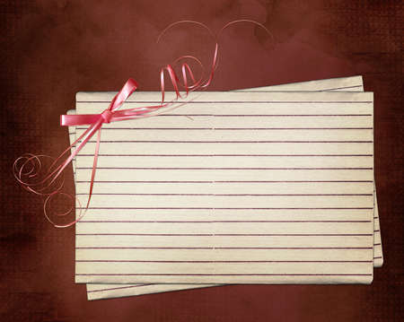 Grunge card with sheet and pink bowの写真素材