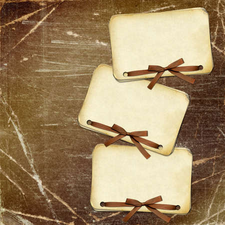 Grunge papers with bow on dark backgroundの写真素材