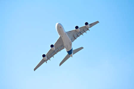 photograph of airliner in a blue skyのeditorial素材
