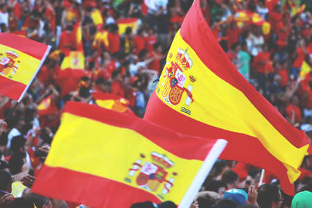 Spanish fans celebrate victory holding flags, Spain soccer fansのeditorial素材