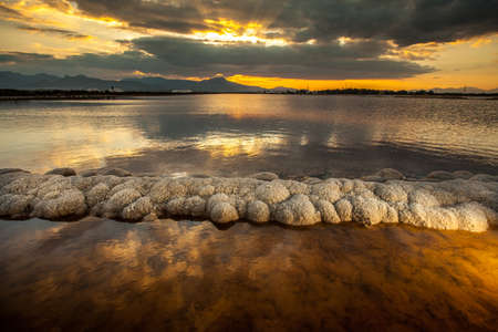 Sunset in a deposit of saltの写真素材