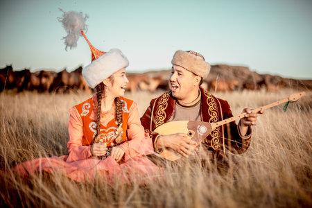 Kazakh woman and man in national costumesの写真素材