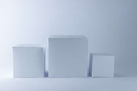 Three square paper boxes mockups on white background, 3D handmade paper boxの写真素材