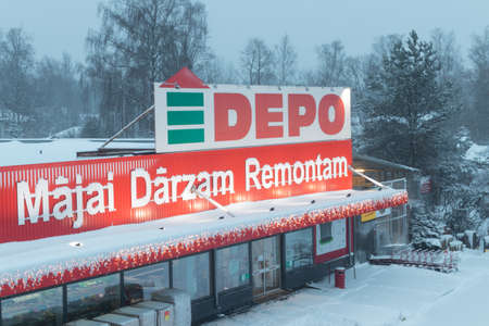Riga, Latvia -January 13, 2021: DEPO shopping center on a snowy winter morning. Latvian building materials trade chain Depo.のeditorial素材