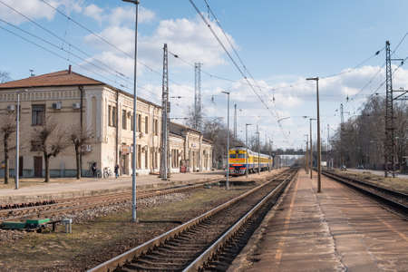 Riga, Latvia, March 26, 2019 - Local train at the train station on a sunny dayのeditorial素材
