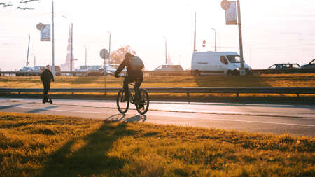 Riga, Latvia - October 6, 2021: Morning traffic on a sunny autumn morning, people in hurry to workのeditorial素材