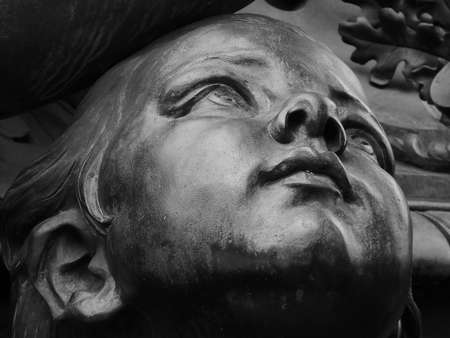 Bronze children looking up - This is a detail of a sculptureの写真素材
