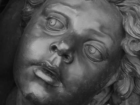 Bronze children looking up - This is a detail of a sculptureの写真素材